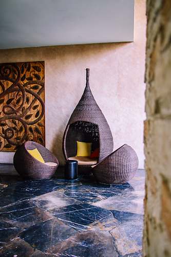 home decor three brown wicker chairs hotel